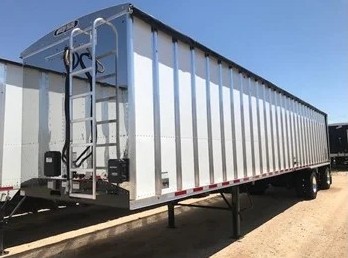 White belt trailer with tall aluminum sidewalls and a front ladder
